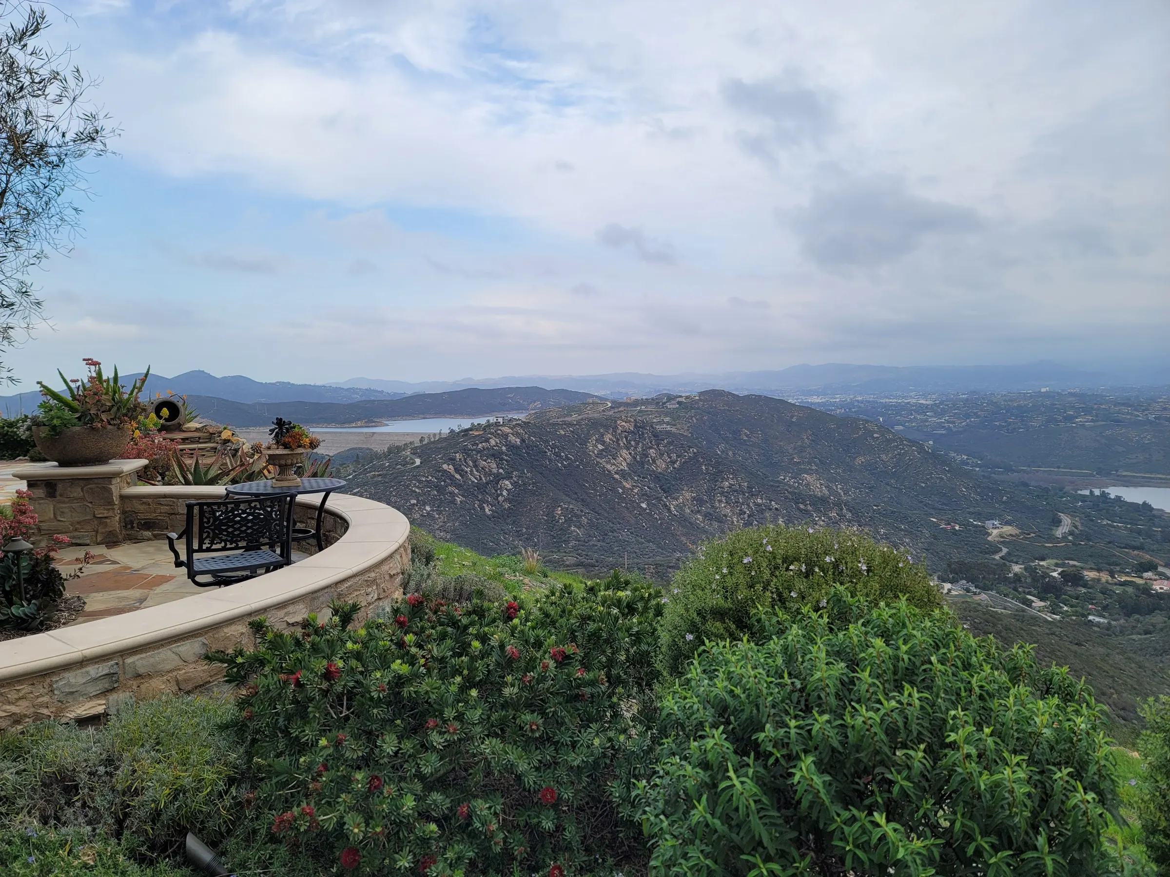 Finished San Diego landscape with planted areas, lawn, and connected walkways