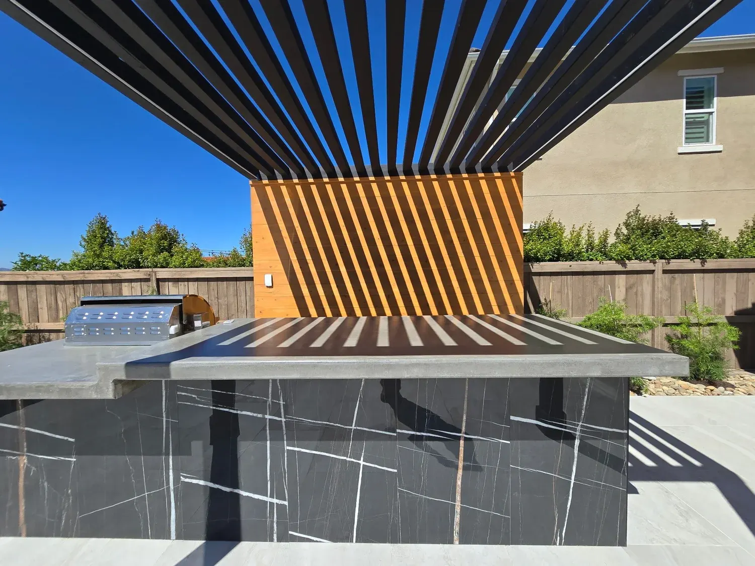 Covered outdoor kitchen and dining area