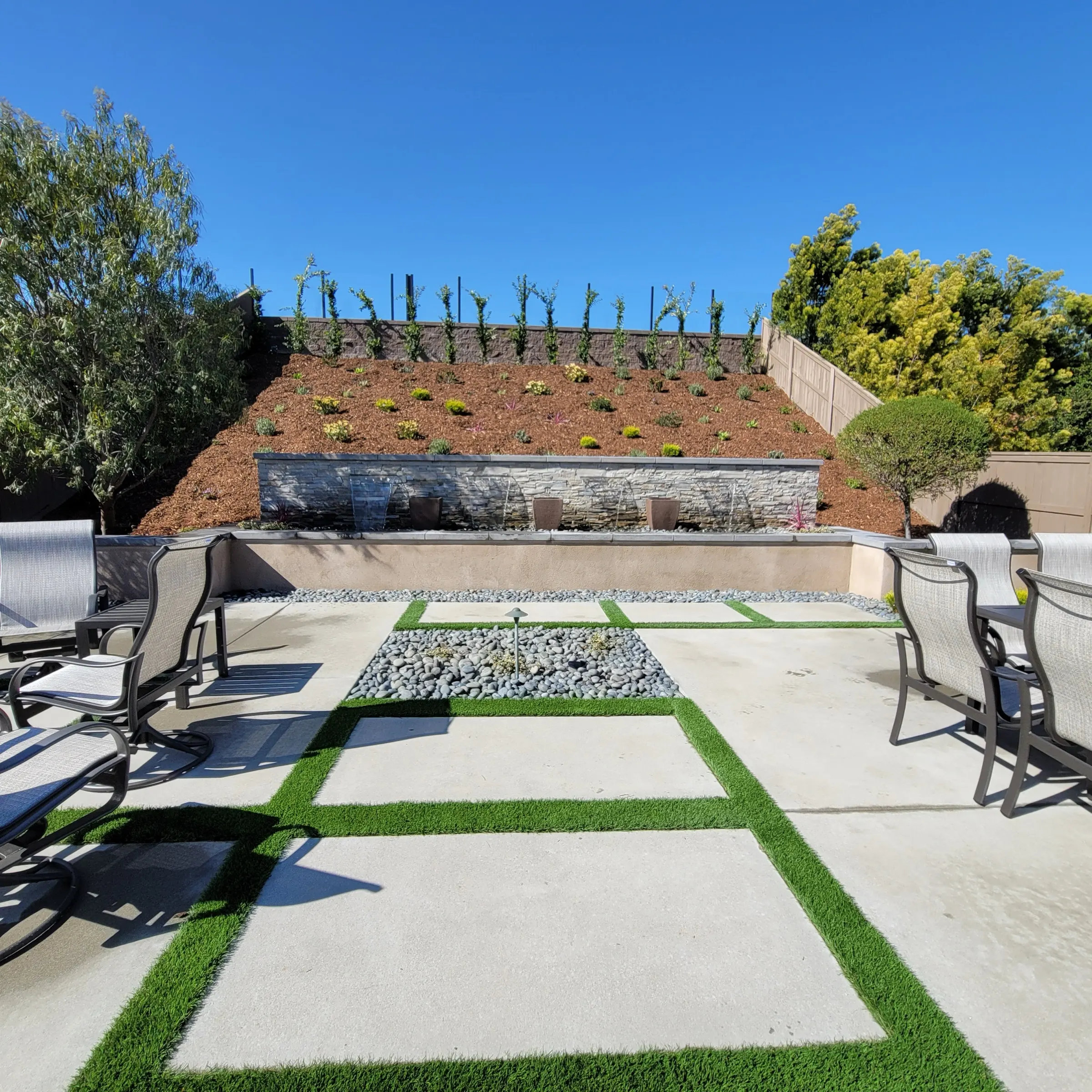Retaining wall with planting and a finished landscape